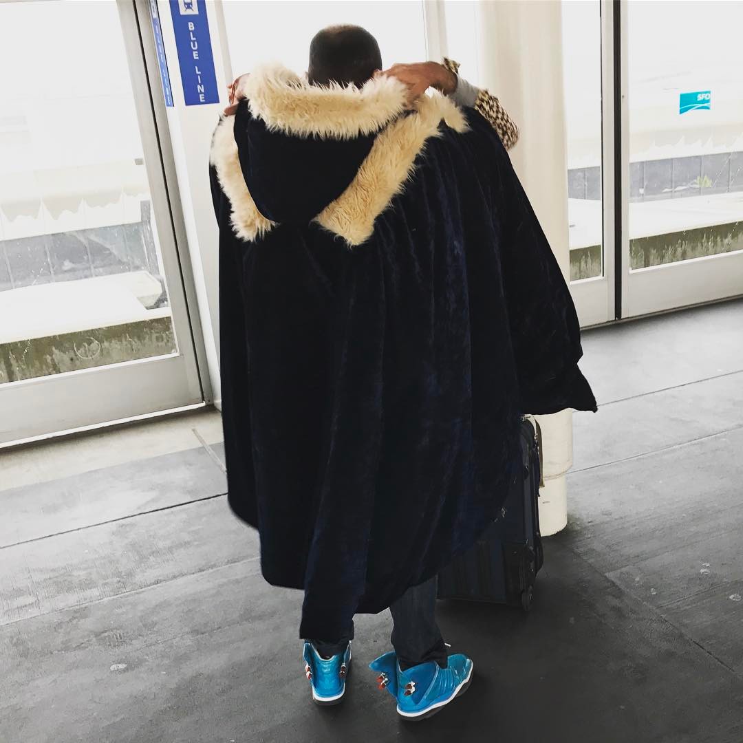 Land in SF, immediately spot guy wearing fur-trimmed cloak, with light-up crazy shoes.